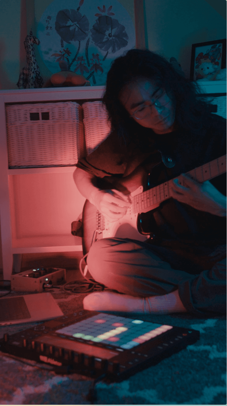 Picture of Cardin playing guitar